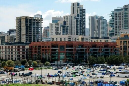 Makeshift tent encampments for people displaced by the war at a parking area near Beirut's waterfront on Thursday
