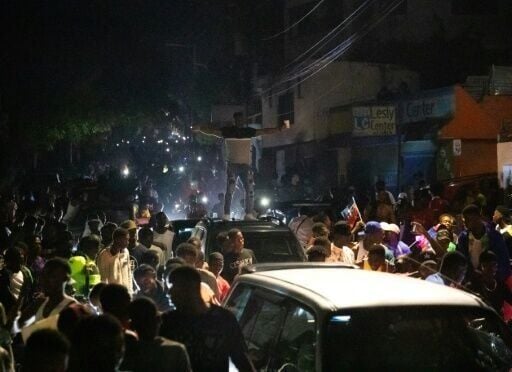Haitian fans go wild after their country's 2-0 victory over Nicaragua propelled it to a World Cup berth