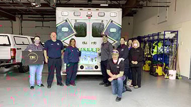Members of Refuge Church in De Soto with first responders from the Valle Ambulance District.