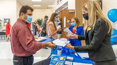 Manuel Schmerber of Crystal City was on the hunt for an IT position at the 2021 Job Fair, and Express Employment marketing coordinator Alexis Endsley explained the process to him.