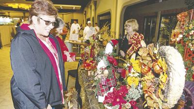 Kim Gamel of Crystal City checks out holiday decor at last year's Leader Holiday Shopping Spree.