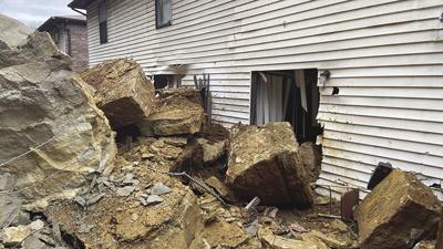 A landslide south of Arnold sent rocks crashing into apartments.