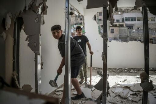 Oday, 13, and his brother Omar, 12, took the took the day off school to help their grandfather Omar Abu Rajab demolish his own home so he wouldn't have to pay the municipality to do it