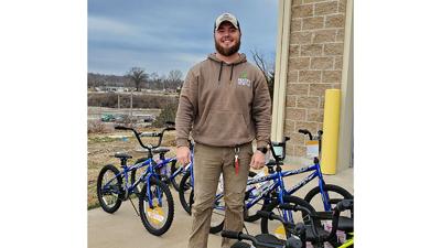 Tyler Deaton, owner of Deaton Landscaping & Co., last year collected donations of bicycles, scooters, tricycles and helmets for 66 children in the Dunklin R-5 School District.