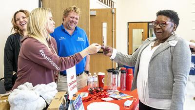 At the 2022 fair, Norma Bisch of De Soto, right, stops to talk with Christine Gleason about job positions at Scenic Nursing and Rehab Center. (copy)