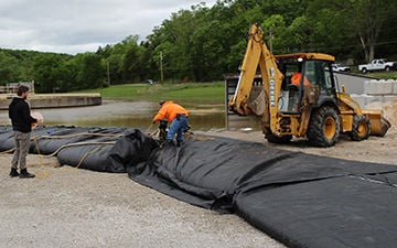 Public Water Supply District 2 works to contain flooding