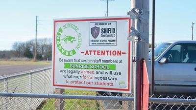 The Sunrise School District has signs letting visitors know some staff members are armed.