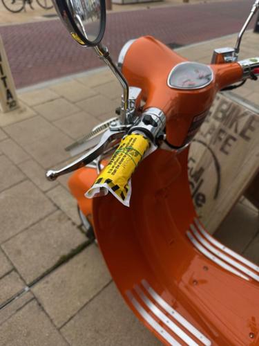 Parking ticket issued to restaurants decorative bike mascot