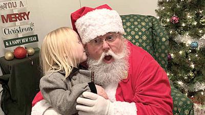 The late Gwen Stough of Arnold submitted this snapshot for last year’s contest of her granddaughter, Sadie Stough, visiting St. Nick at the Santa House in Festus.
