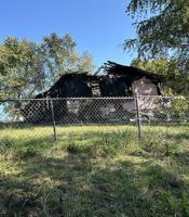 Two treated following De Soto-area house fire