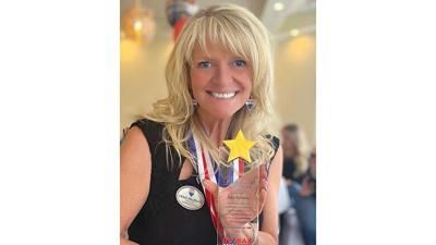 Traci Palmero, holding an award she received in 2021, says it is important to choose a Realtor with experience.