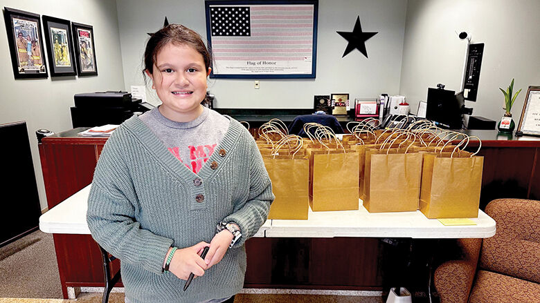 Paulina Pullen assembles and delivers “Blessing Bags” for members of the Rock Community Fire Protection District.