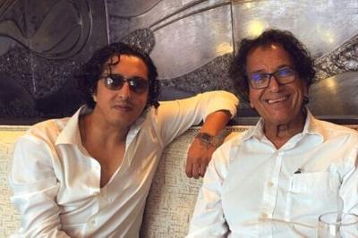 Saad Ibrahim Almadi (right), who was jailed in Saudi Arabia over his social media posts, is seen with his son in a 2021 picture released by the family