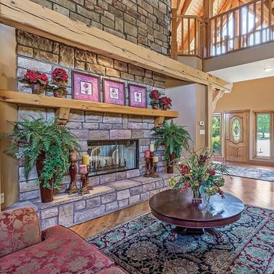 This five-bedroom home in Piedmont features a stone fireplace and an in-ground pool.