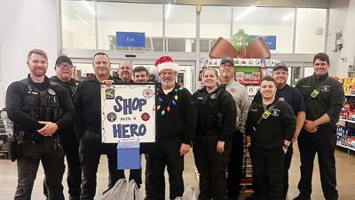 Volunteers from several agencies help with Byrnes Mill Shop with a Hero.