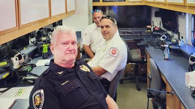 From front, Eureka Police Chief Michael Wiegand, Assistant Fire Chief Scott Barthelmass and Fire Marshal Rich Pallarito sit in the St. Louis Regional Response System mobile command center at Eureka High School.