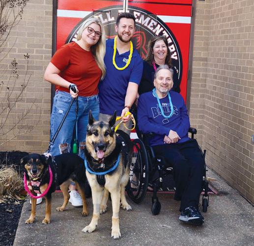 Front from left, Charlie, TJ, and Rick Kleb, with, back from left, Julie Walters, Brett Walters and Pamela Walters Kleb were part of a parade on March 14 to honor TJ.