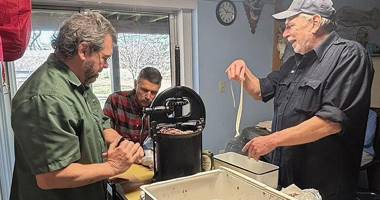 OUTDOORS: Homemade sausage completes hunter's work with help from friends
