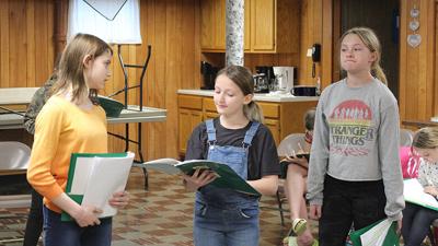 From left, Gwendolyn Kurt, 12, of Festus, Clara Kutrip, 11, of Dittmer and Aubrey Etter, 14, of Festus rehearse for the upcoming production.