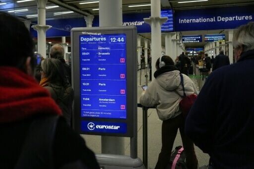An electronic board showed 'cancelled' for Eurostar departures at St Pancras station in London