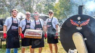 From left, Jaden Kraus, Tim Hahn of Cedar Hill, Ronnie Mueller of Cedar Hill and Scott Link of Grubville stand near the grill at the BackStoppers BBQ.
