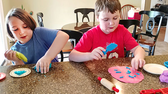 Gabriel (Kindergarten) and Shane Sedrick (2nd grade) at R7 school Our clay was edible and we enjoyed tasting it.jpg