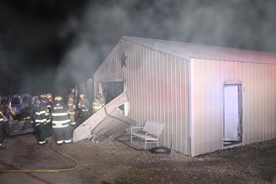 Fire damages garage west of De Soto