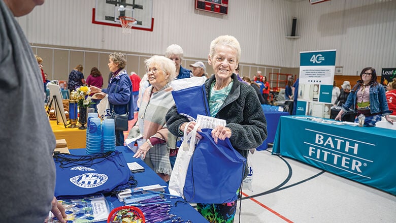Holly Patterson of Arnold visits booths at last year's De Soto Senior Expo.