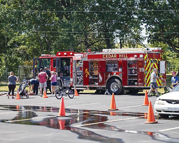 The Cedar Hill Fire Protection District displays firetrucks and other equipment at the anniversary celebration.