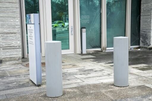 Shattered glass could be seen in the snow outside the building's entrance