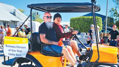 Eddie Buck rides through the 2022 Eureka Days parade while his son drives.