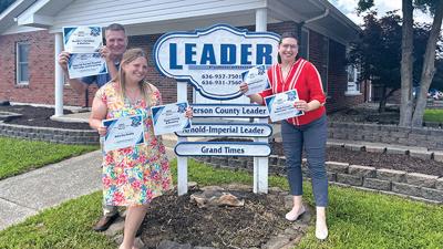 Leader sales staff Rob Schneider and Kayla Rhineberger, along with digital marketing manager Katelyn Mary Skaggs, show off some Best of Jefferson County awards.