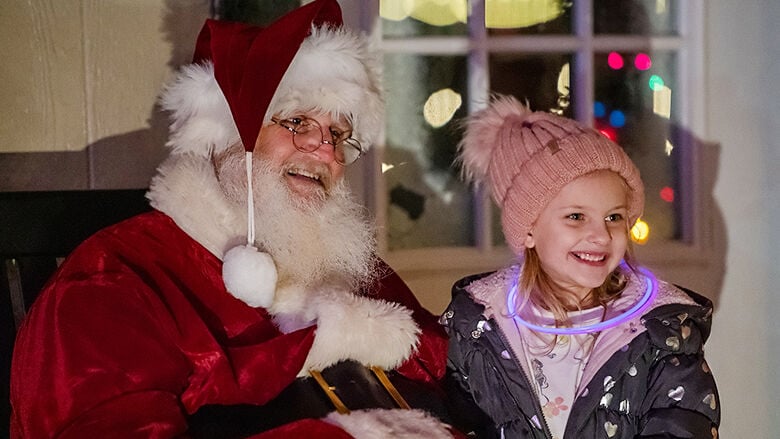 Zuri McClelland, 6, of Arnold, visits Santa at Arnold’s inaugural Christmas in the Park event.