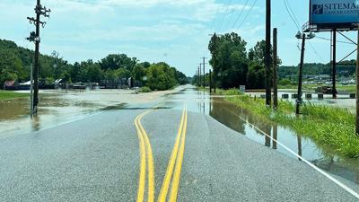 Flash flooding at Old Hwy. 141 and 13th Street in the Fenton area on Sunday.