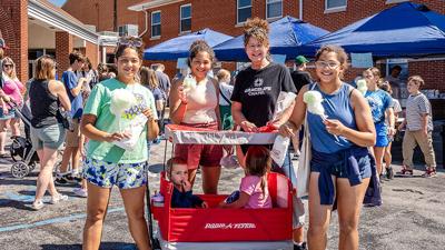 De Soto residents Laura Borman, third from left, with 14-year-old triplets, from left, Gianna, Gracie and Gwen Davis along with Jaxson, 2, and Aubrey, 4, Rech, were among the thousands who attended the 30th annual Twin City Days on Sept. 4-6 in Crystal ...
