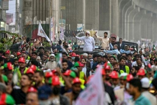 Jamaat-e-Islami chief Shafiqur Rahman waves to supporters during a rally on the final day of campaigning in Dhaka on Monday