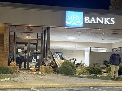 Festus bank damaged but still open after pickup crashes into building
