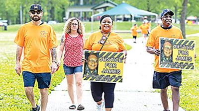 Brigit Brooks, center, wife of accident victim James Brooks