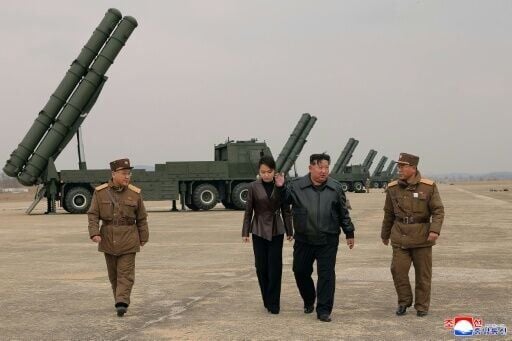 North Korean leader Kim Jong Un and his daughter Kim Ju Ae observing a training exercise