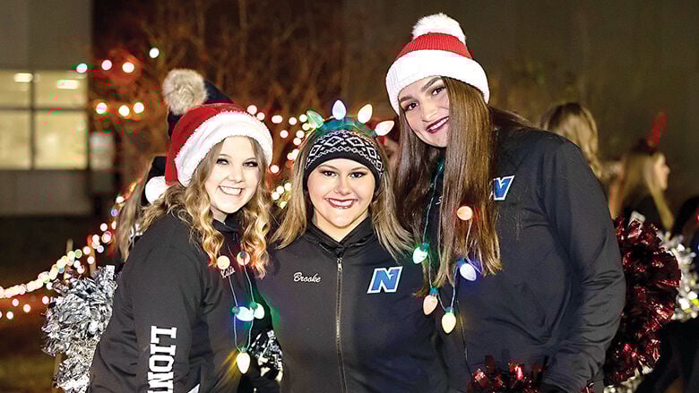 Northwest Lionettes Maddie Woodward, Brooke Rowley and Sami Dean before marching in the 2022 House Springs Christmas Parade.