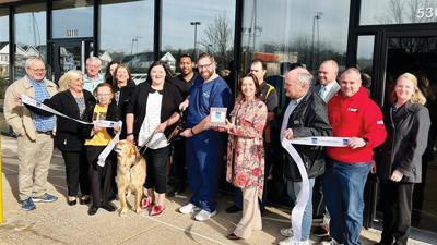 The Fenton Chamber of Commerce helped Matthew Lazarus, center, cut the ribbon to open his new practice, Lazarus Eye Care, in High Ridge.