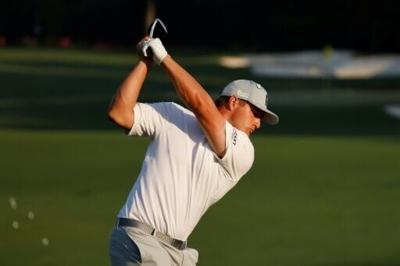 Two-time US Open champion Bryson DeChambeau of the United States hits on the driving range ahead of the 90th Masters