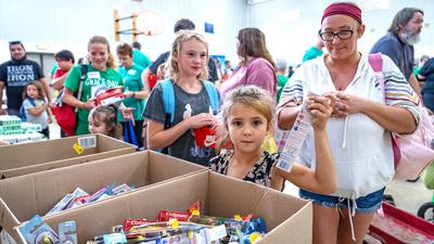 Scarlett Vaccaro, then 7, of Cedar Hill picks a toothbrush at last year's Grace Day at Immanuel Lutheran Church in Festus.