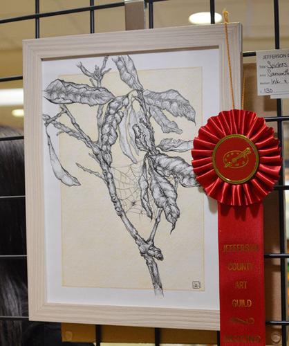 Samantha Ladd took second with an ink-and-colored-pencil drawing of a spider spinning a web on a branch.