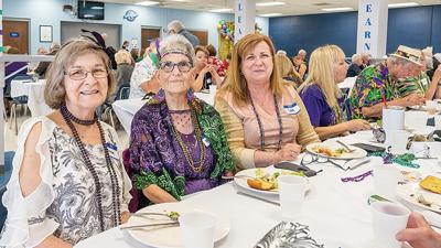 From left, friends Arlene Hejlek of Fenton, Kathy Graff of House Springs and Carol Smith of Arnold, who met one another through line dancing, enjoy time together at the Senior Prom at Northwest High School.