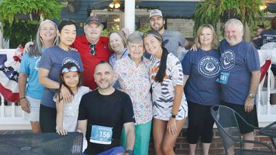Gregg Ratliff, last on right, started the Kimmswick 5K and 1-mile walk and fun run for his wife, Nancy Ratliff, who was diagnosed with ALS in 2008. She died at age 67 in 2016.