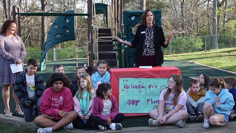 Jefferson College President Dena McCaffrey speaks at the Early Childhood Center playground resurfacing ribbon cutting.