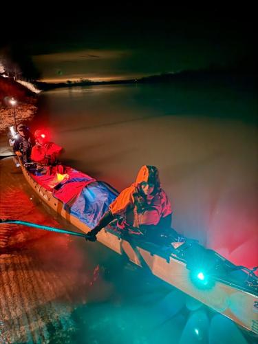 From left, Lád’a Zednik, Curt Leitz and Scott Duffus sit in a canoe