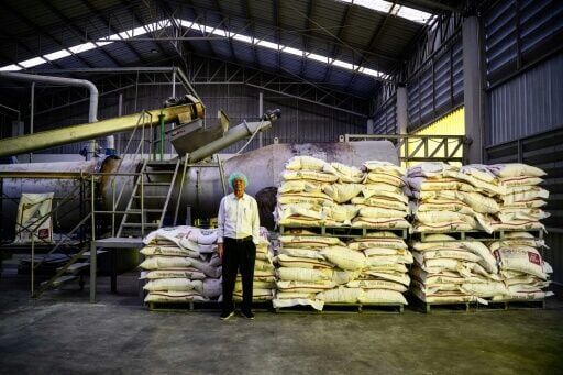 Thai scientist Wichien Yongmanitchai, who developed a microbial product called Soil Digest, designed to eliminate the need for the burning of rice stubble, poses at his factory in Samut Sakhon