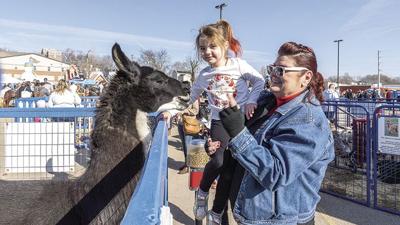 Olivia Mattler, 5, of Arnold and her grandma, Kim Casey of Crystal City, at last year’s WinterFest. This year, festivities will be open from 8:30 a.m. to 6 p.m. Saturday, Dec. 3.